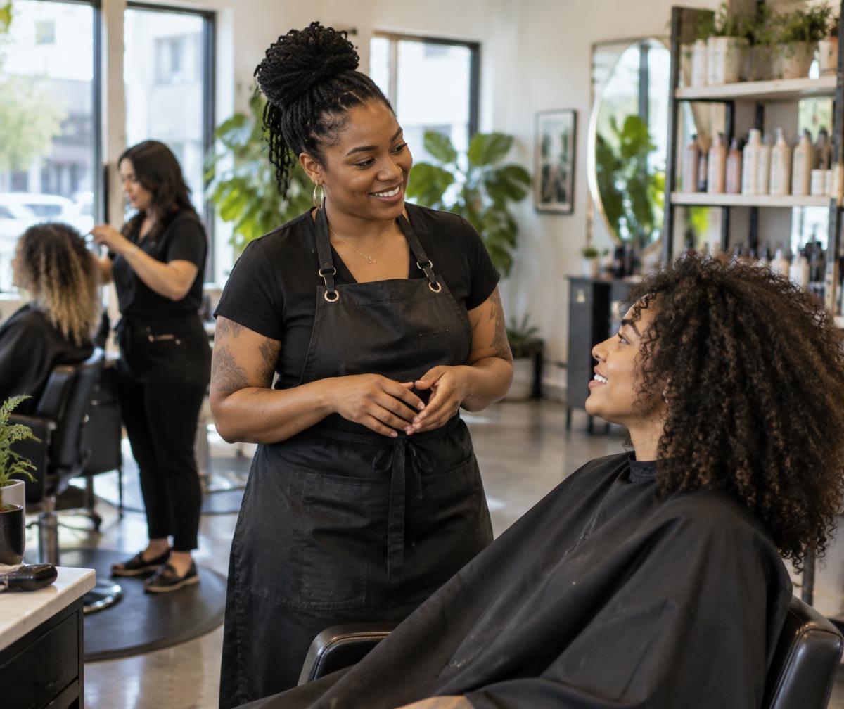 Salon owner with a customer